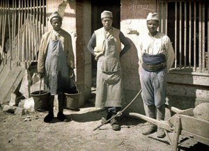 Three Workers from Senegal in Front of a House, Soissons, Aisne, France, 1917